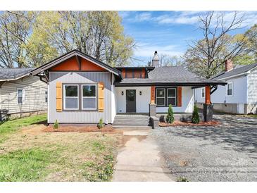 Charming single-story home with gray siding, orange trim, and a welcoming front porch at 908 W Airline Ave, Gastonia, NC 28052