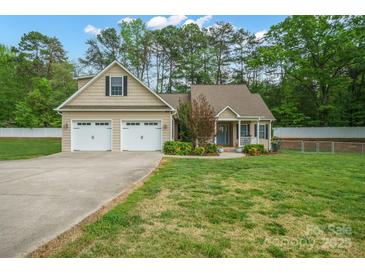 Charming home featuring an attached two-car garage, well-maintained lawn and traditional design elements at 2646 N Olivers Cross Rd, Newton, NC 28658
