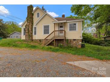 Charming two-story home with stone accents and a cozy front porch at 114 S 5Th St, Albemarle, NC 28001
