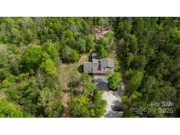 Expansive aerial view of the property showcasing lush green surroundings at 6758 Zion Church Rd, Concord, NC 28025