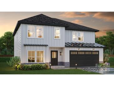 Charming two-story home featuring white siding, a black roof, and an attached two-car garage at Lot 6 Rocky River Crossing Rd, Harrisburg, NC 28075