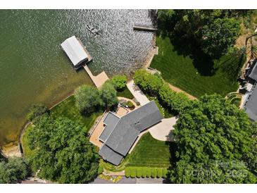 Stunning aerial view of lakefront home with private dock and lush landscaping at 273 Leeward Point Loop # 14, Taylorsville, NC 28681