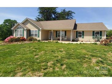 Charming single story home with well maintained lawn and a welcoming front porch at 6454 Sain Milling Rd, Vale, NC 28168