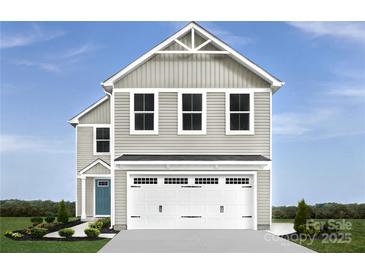 Inviting two-story home featuring neutral siding, a two-car garage, and a charming covered entryway at 5224 Mccallum Meadows Dr, Charlotte, NC 28216