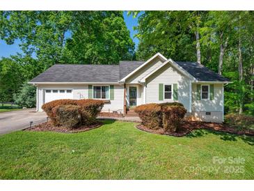 Charming single-story home with well-manicured lawn and inviting landscaping at 177 Candlestick Dr, Statesville, NC 28625