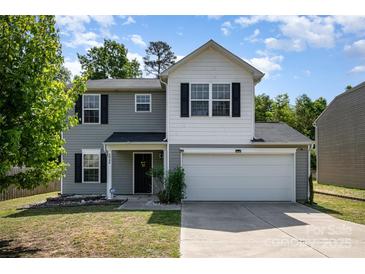 Charming two-story home with gray siding, white accents, and a two-car garage at 2046 E Park Dr, Lancaster, SC 29720