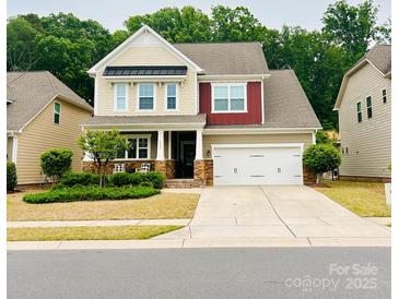 Charming two-story home with manicured lawn, neutral siding, and a two-car garage at 3005 Oakmere Rd, Waxhaw, NC 28173