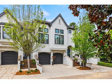 Charming townhome featuring a manicured front yard, a private garage, and a beautifully painted exterior at 208 Wendover Heights Cir, Charlotte, NC 28211