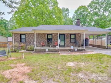 Charming brick home with a covered porch and carport at 335 Linda St, Salisbury, NC 28146