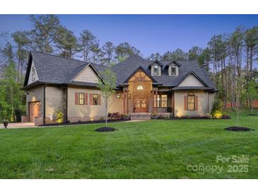Stunning craftsman-style home with manicured lawn, stone accents, and a welcoming entryway at 425 W North Corner Rd, Lancaster, SC 29720