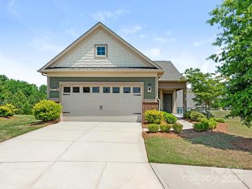 Charming single-Gathering home with a two-car garage, manicured landscaping, and a welcoming front facade at 1026 Kirby Dr, Fort Mill, SC 29715