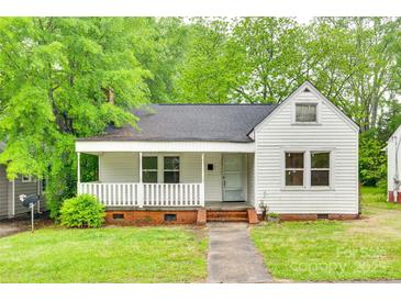 Charming single-story home with covered front porch and brick foundation at 146 Walnut St, Chester, SC 29706