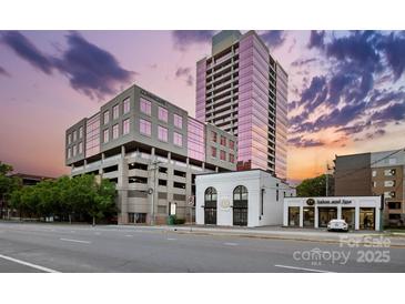 Street view of building featuring modern architecture and nearby shops against a beautiful sky at 315 Arlington Ave # 1104, Charlotte, NC 28203