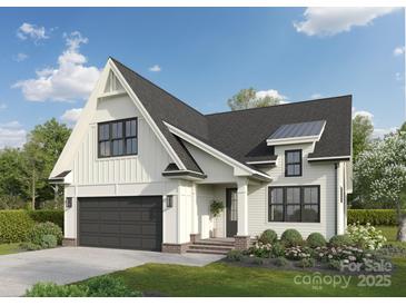 Charming two-story white modern farmhouse with black trim, landscaping, and attached two car garage at 105 Wharf Ln # 1, Statesville, NC 28677