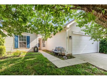 Charming single-Gathering home with a two-car garage, tidy landscaping, and a walkway to the front door at 228 Grayland Rd, Mooresville, NC 28115