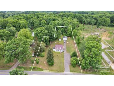 An aerial view of the property, surrounded by lush trees, showcasing the home's location at 3101 Hickory Hwy, Statesville, NC 28677