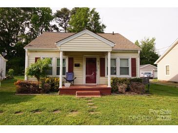 Charming bungalow with a covered porch and well-maintained front yard at 615 Mauney Ave, Kings Mountain, NC 28086