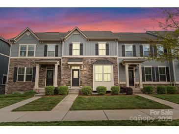 Charming townhomes showcase stone accents, manicured lawns, and inviting entryways, creating an appealing curb presence at 2037 Birchside Dr, Charlotte, NC 28205