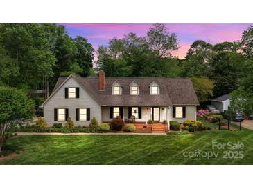 Charming two-story home with a manicured lawn and inviting front porch, perfect for enjoying the neighborhood views at 3022 8Th Street Ne Ct, Hickory, NC 28601