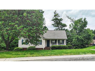 Charming single-story home featuring a cozy front porch and well-maintained landscaping at 735 Shuttles Way, Fort Mill, SC 29715