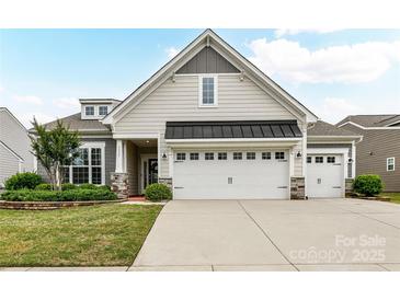 Charming home with a two-car garage and well-maintained landscaping in a modern color palette at 3333 Oliver Stanley Trl, Lancaster, SC 29720
