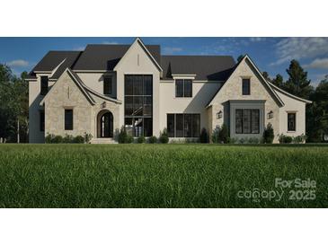 Stunning two-story home showcasing a blend of stone and brickwork, complemented by dark-framed windows and lush green landscaping at Lot 3 Holbrook Rd # 3, Fort Mill, SC 29715