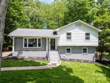 Charming split-level home featuring a brick facade and well-maintained landscaping at 2009 Edgewater Dr, Charlotte, NC 28210