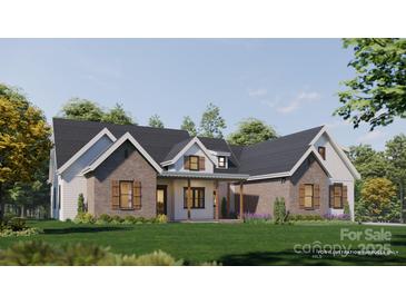 Beautiful single-story home with a brick and siding facade, black roof, and a well-manicured lawn at 1905-A Bechtler Rd, Edgemoor, SC 29712