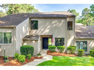 Inviting home exterior with manicured lawn and garden, American flag, and visible address at 173 Greenridge Rd, Lake Wylie, SC 29710