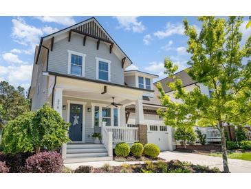 Charming two-story home with a covered front porch and beautifully landscaped front yard at 376 Sensibility Cir # 8, Fort Mill, SC 29708