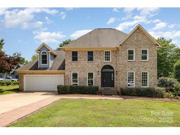 Charming brick two-story home with well-manicured lawn and attached garage at 109 Arabian Ln, Salisbury, NC 28147