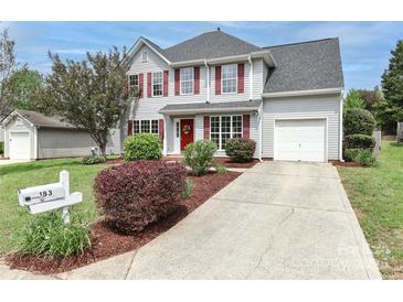 Charming two-story home with red shutters, landscaped yard, and a concrete driveway at 183 Bellelaine Dr, Mooresville, NC 28115