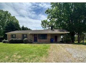 Charming brick ranch-style home featuring a covered carport and well-maintained landscaping at 2030 Keisler Dairy Rd, Conover, NC 28613
