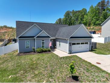 Charming single-Gathering home features a two-car garage, vinyl siding, and a well-manicured lawn at 2205 Philadelphia Church Rd, Dallas, NC 28034