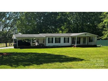 Charming single-story home with a spacious front yard and convenient carport, offering comfort and practicality at 321 Jennings Rd, Statesville, NC 28625