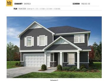 Charming two-story home with a well-maintained lawn and a two-car garage at 918 Windy Oak Ct, Indian Trail, NC 28079