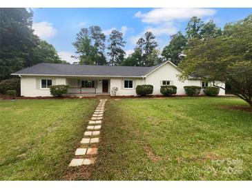 Charming, single-story home with a well-manicured lawn and inviting walkway at 141 Edenvale Rd, Rock Hill, SC 29730