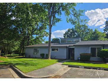 Charming single-story home with mature trees and well-maintained landscaping at 11216 Carmel Chace Dr, Charlotte, NC 28226