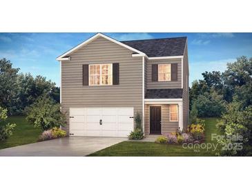 Charming two-story home with a gray exterior, white garage door, and landscaped front yard at 1045 20Th Avenue Se Loop, Hickory, NC 28602