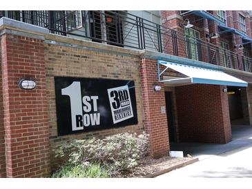 Building signage indicating '1st Row' and '3rd Ward Warehouse District' on a brick facade at 1101 W 1St St # 408, Charlotte, NC 28202