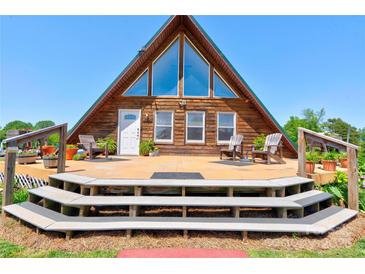 A-frame cabin with expansive windows and inviting front deck, perfect for enjoying the outdoors at 1307 Tiffany Ln, Shelby, NC 28152