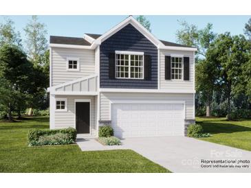 Charming two-story home featuring a two-car garage, a welcoming front porch, and a combination of siding and stone accents at 151 Astor St, Troutman, NC 28166