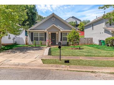 Charming single-Gathering home with a well-manicured lawn and inviting front entrance at 2126 Downing St, Charlotte, NC 28205