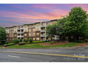 Charming multi-story condo building with well-maintained landscaping and private balconies at 1000 E Woodlawn Rd # 315, Charlotte, NC 28209