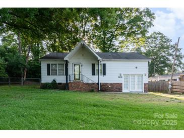 Charming single-story home featuring white siding, a brick foundation, and a well-maintained lawn at 1108 Old Dallas Hwy, Dallas, NC 28034