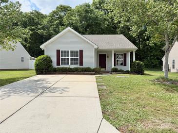 Charming one-story home featuring a well-maintained front yard and long concrete driveway at 1252 Shenandoah Cir, Rock Hill, SC 29730