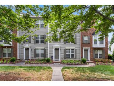 Charming townhome showcasing a well-manicured lawn and inviting facade at 15746 Marvin Rd, Charlotte, NC 28277