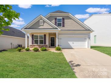 Charming single-Gathering home with well-manicured lawn and attached garage at 4527 Dover Ct, Denver, NC 28037