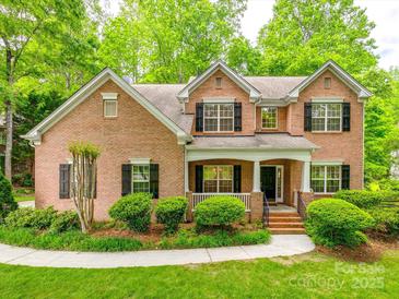 Beautiful brick two-story home featuring well-maintained landscaping and classic black shutters at 720 Kingsmill Ln, Clover, SC 29710