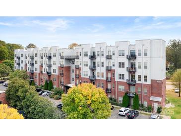 An inviting exterior view of the modern apartment building, featuring brick and metal accents at 2338 Yadkin Ave # 101, Charlotte, NC 28205